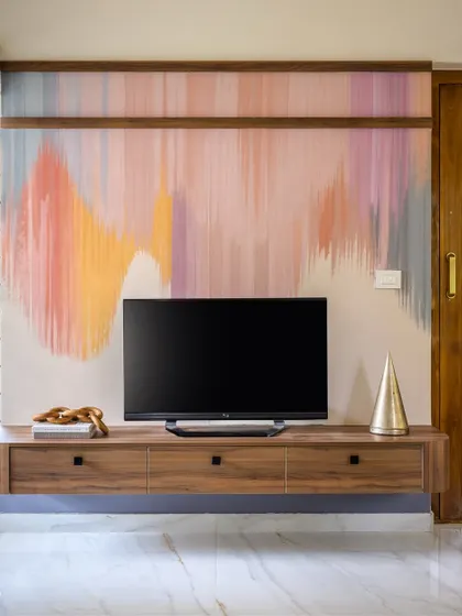 This versatile guest and media room on the ground floor of 'Villa Calmora' was designed as a "bachelor pad" for the gentlemen of the house. The abstract wall art adds a playful and dynamic spirit.