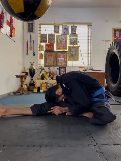 A single-leg forward fold, isolating one hamstring at a time for a deeper and more focused stretch.
