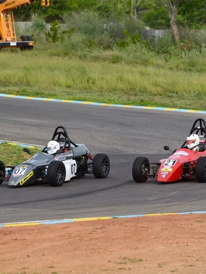 An overtake in progress. Our driver in car 21 executing a pass on a competitor, a move perfected through our racecraft coaching.