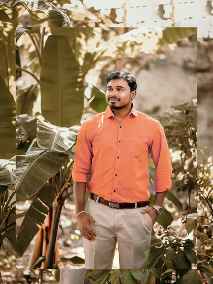 A relaxed groom portrait taken outdoors, with a soft, natural background.