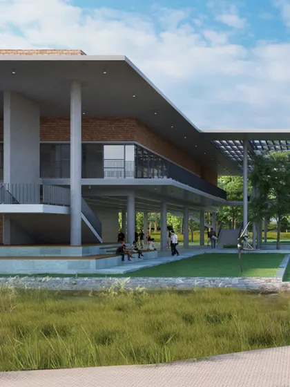 The ground level of the recreation centre, showing open, column-supported spaces that connect directly to the surrounding lawn and landscape. These areas foster interaction and provide shaded spaces for students to gather.