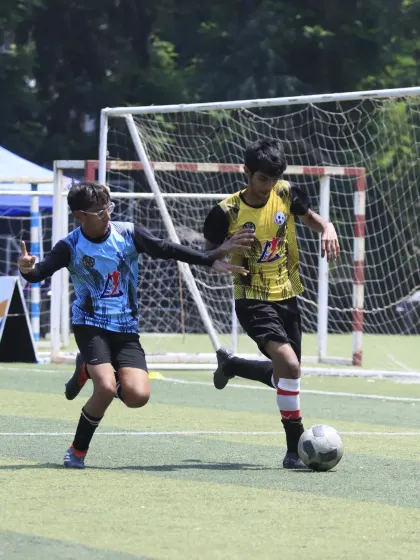 A player from our U-15 team makes a run down the wing during the semi-final, looking to create a scoring opportunity. His focus and determination are clear.