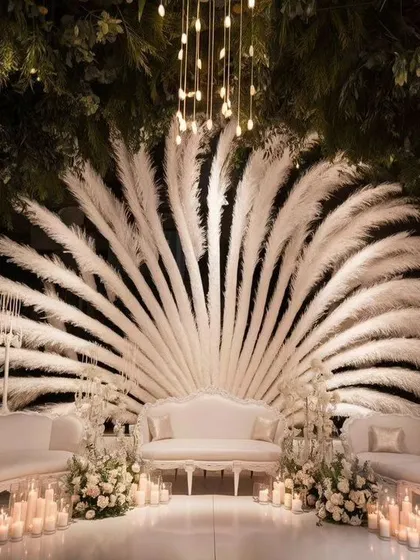 For a modern and chic reception, I designed this stunning stage using pampas grass and elegant lighting. This shows my ability to work with contemporary wedding decor trends to create a unique look.