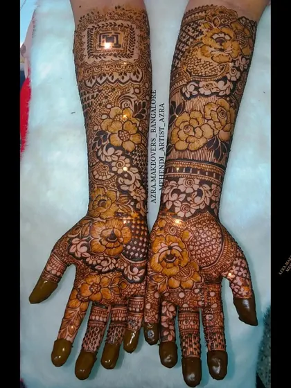A full coverage bridal design with a mix of floral and geometric patterns, perfect for a grand and traditional wedding.