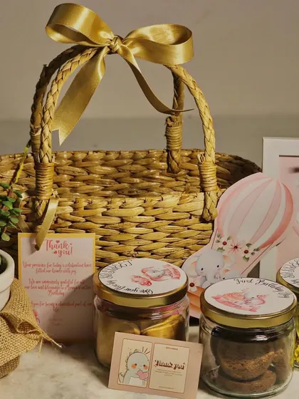 A look at the contents of the elephant-themed birthday basket, showing the custom-labeled jars and personalized cards that make each gift feel special.