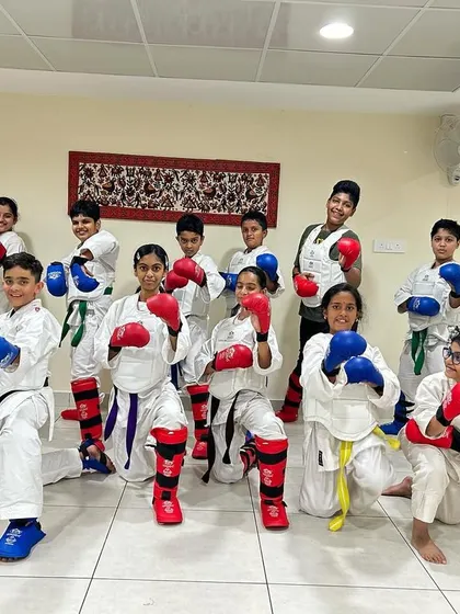 Our students pose with their fighting stances, showing the energy and enthusiasm they bring to every kumite training session.
