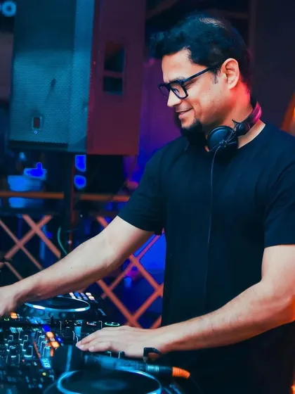 In the zone, mixing tracks and creating a seamless flow of music for the party.