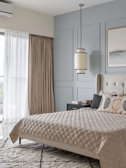 A bedroom from the "neutral chic home" project by Weespaces, featuring our custom upholstered bed with a winged, button-tufted headboard.