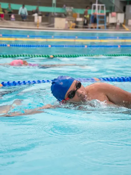 With the right encouragement and training, there are no limits. A swimmer practices their freestyle, building speed and endurance.