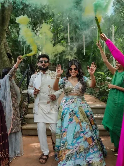 The energy of the baraat and pre-wedding festivities is infectious. We capture the couple and their friends dancing, playing games, and celebrating with pure, uninhibited joy.