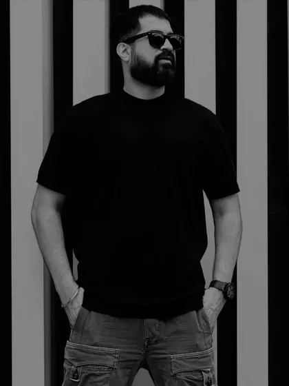 A strong, posed black and white portrait.