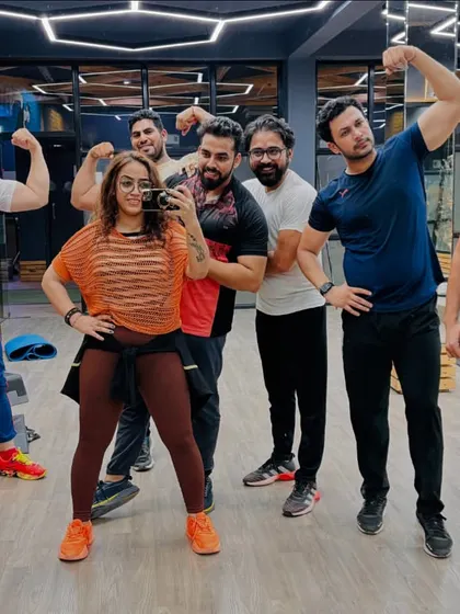 The morning Zumba gang, full of energy and ready to crush it. A mirror selfie capturing the smiles and muscles after a great cardio session. This is how we start our day.