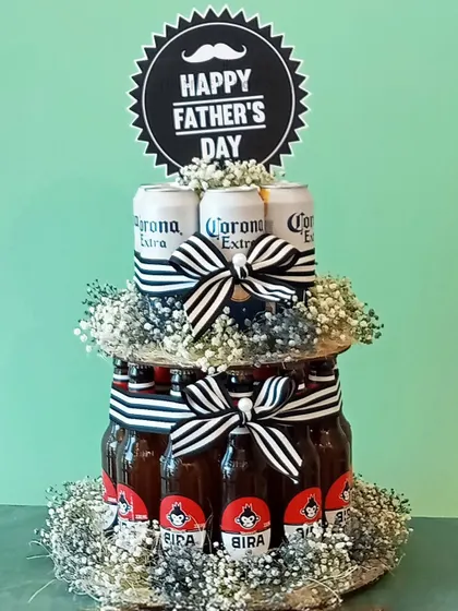 A close-up of the Father's Day beer cake. This fun and creative arrangement is perfect for the dad who appreciates a cold beer and a good laugh. It's a gift that's guaranteed to be a conversation starter.