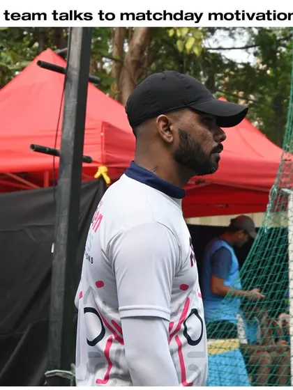 Our coach, focused and observant on the sidelines during a match. This dedication ensures our players get real-time feedback and support when it matters most.
