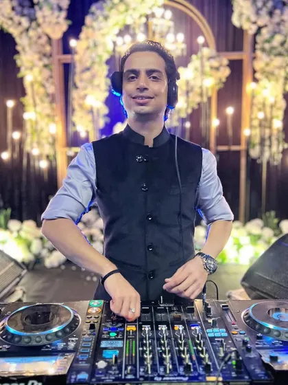 An euphoric feeling with the music playing. A shot of me at the console in front of an elegant, candle-lit backdrop in Jaipur.