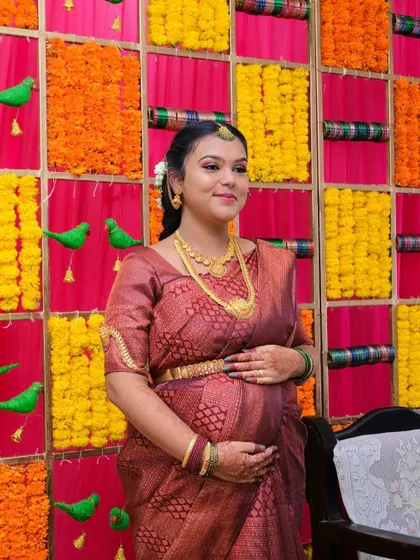 A beautiful, happy portrait from her baby shower. The makeup is designed to look fresh and natural, perfect for celebrating this special milestone.