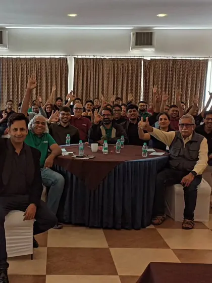 A happy group photo after my performance at an offsite event. The thumbs-up from the audience is the best review an artist can get.