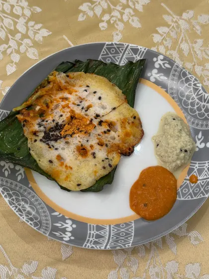 A plated shot of our popular Khada Masala Spot Idli, served with traditional coconut and tomato chutneys. A perfect bite-sized starter.