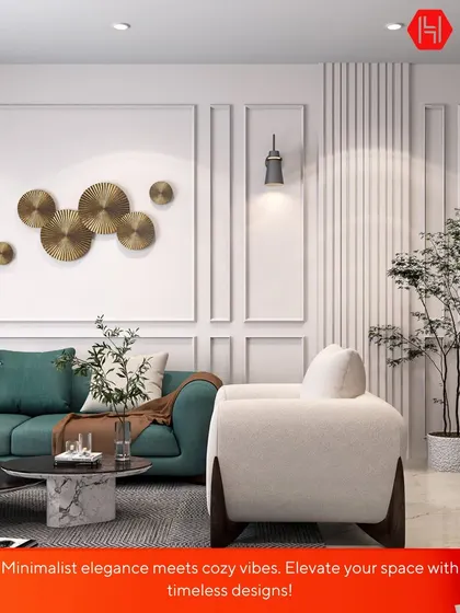 Minimalist elegance meets cozy vibes in this living room design. The clean white walls with paneling provide a perfect backdrop for the plush teal sofa and modern metallic wall art, creating a space that is both timeless and inviting.