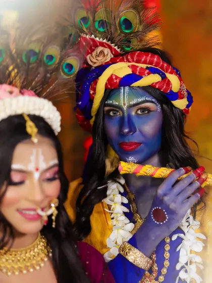 A creative composition focusing on Krishna, with Radha slightly out of focus, creating depth and telling a story.