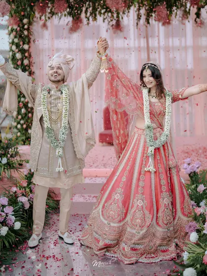 A moment of pure celebration as the newlyweds are showered with petals. We capture the energy and joy that fills the air right after the wedding ceremony.