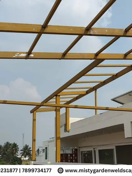 The bare metal frame of a pergola under construction. We use high-quality steel to ensure the structure is strong and can withstand the elements.
