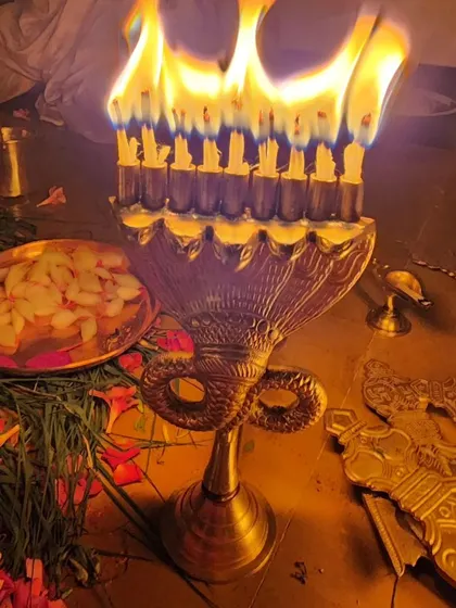 A special multi-wick lamp used for performing aarti to the Goddess.
