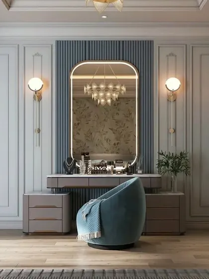 An elegant and classic dressing room with beautiful wall panelling. The large vanity with a decorative mirror and comfortable seating creates a serene and sophisticated space.