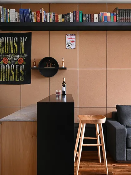 This shot shows the custom bar unit in the context of the seating area. We designed the bar to be a natural extension of the room, providing a dedicated space for entertaining without disrupting the relaxed feel of the lounge.