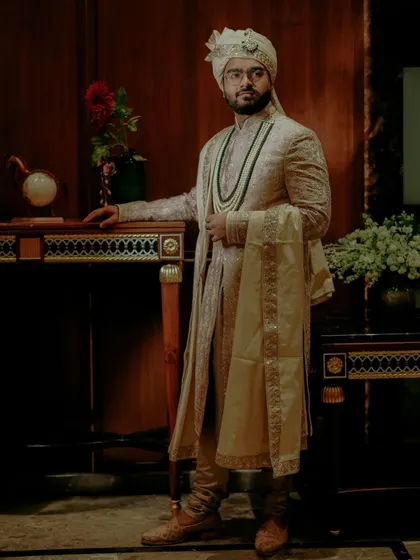 A stylish portrait of the groom, exuding confidence and elegance in his wedding attire.