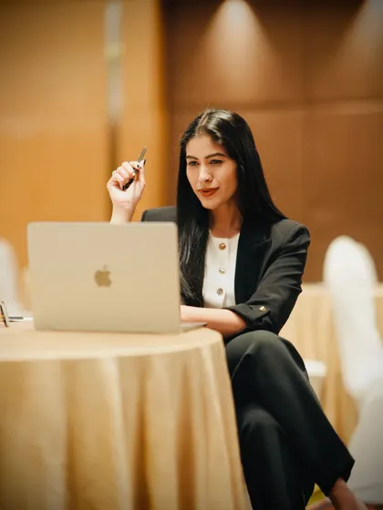 A thoughtful moment during a corporate event. I am deeply engaged in my work, constantly thinking about how to best serve my clients and deliver value.