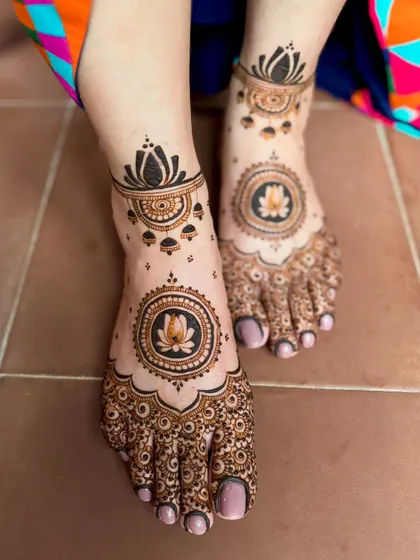 An angled view of the lotus mandala feet design.