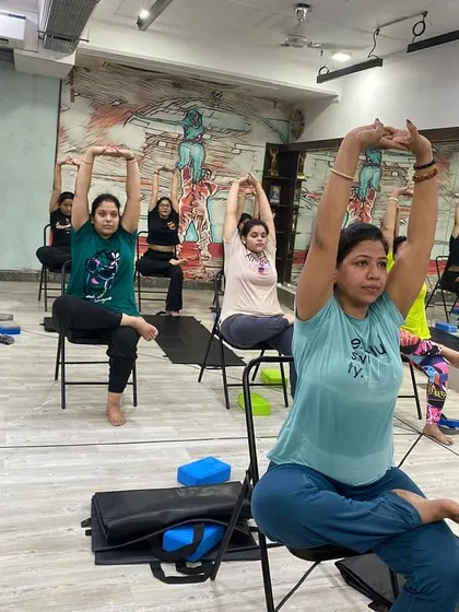 A seated stretch that helps open the shoulders and chest, improving posture and releasing tension.