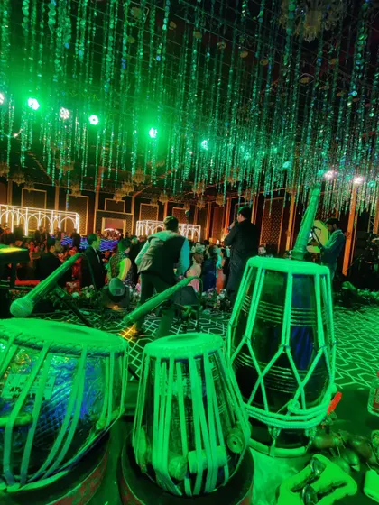 The stage bathed in green light at a Sufi night in Jaipur. The ambiance is just as important as the music for creating the right mood.