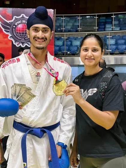 Celebrating a Gold Medal win at the India Open International Karate Championship with my mentor. This victory came with a cash prize, a testament to the rewards of dedication.