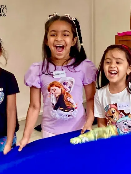 The pure joy and laughter of children fully engaged in a music activity. This is the heart of what we do at the foundation.