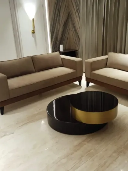 A wider view of a living room set we designed, including two sofas and a statement coffee table. This shows how we approach creating a complete and balanced furniture arrangement for a space.