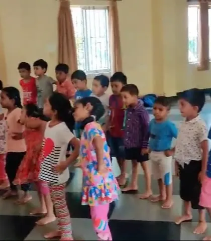 Young campers stand in formation, learning the basics of stage presence and coordinated movement. These foundational exercises are part of our theatre and dance training curriculum.