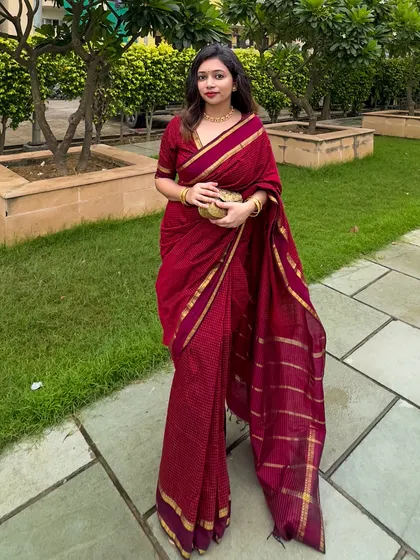A classic pose showing the elegance of the South cotton saree. The gold border adds just the right amount of festive shine.