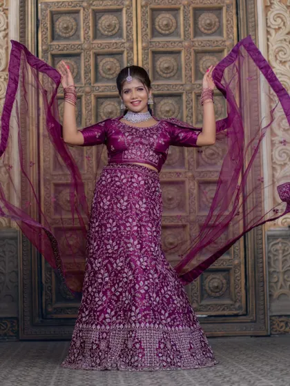 A playful shot with the dupatta flowing, this image shows the movement and grace of this rental lehenga.