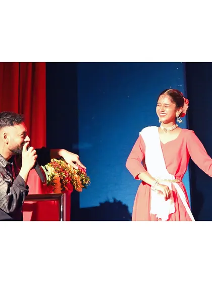 A beautiful, candid moment of me interacting with a classical dancer on stage. It shows my respect for all art forms and my ability to connect with different types of performers.