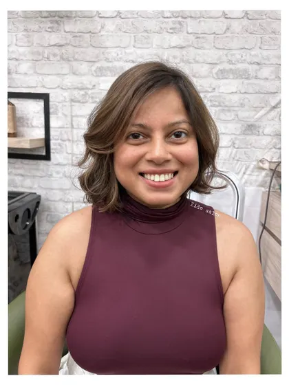 A beautiful example of a modern bob with subtle highlights. The soft brown tones are blended seamlessly to create dimension that looks natural, like a global color.