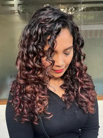 A close-up of the beautiful burgundy tones on her curls.