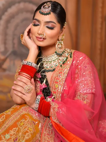 A soft and dreamy pose that showcases the beautiful blend of colors in her eye makeup and the gentle glow on her skin. It's a moment of quiet elegance.