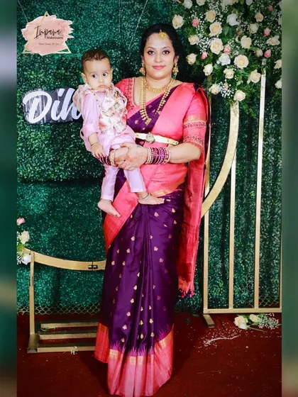 The new mother with her baby. It was a pleasure to create a special look for her on this memorable day.