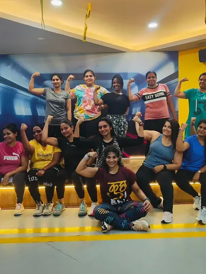 The heart and soul of my classes. Each photo captures a unique moment with my incredible community after a sweaty, joyful session. This is our shared victory lap.