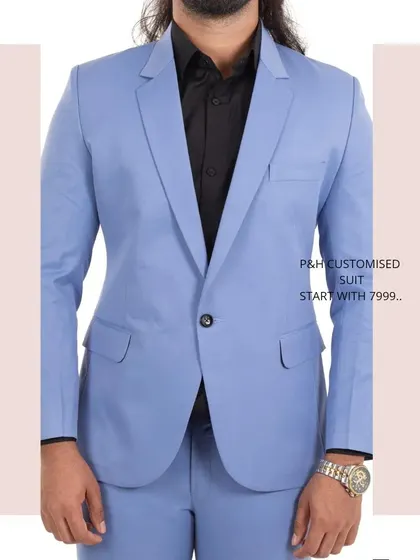 A close-up of the sky blue suit jacket, highlighting its classic lapel and single-button closure.