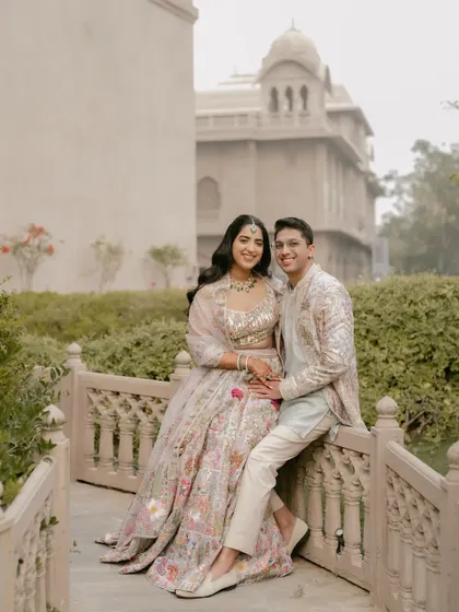 A serene portrait on a bridge at the Fairmont Jaipur. This image has a storybook quality, perfectly capturing the romance of a palace wedding.