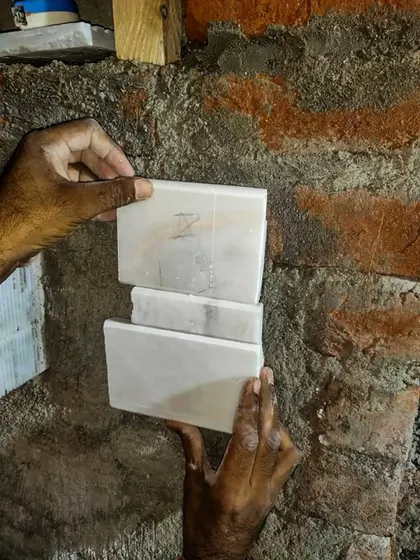 The evolution of design, from selecting the right marble for a project to ensuring the veins match perfectly. This image shows the hands-on artistry and precision in our design journey.