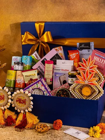 An overflowing hamper for Diwali, styled with traditional 'Shubh Labh' decor and diyas to capture the complete festive gifting experience.
